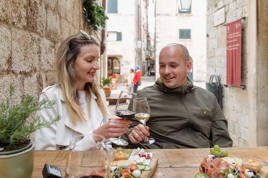Dubrovnik Old Town: Night tour with History, Wine & Bites - The wine bar stop, 2 glasses plus real local bites