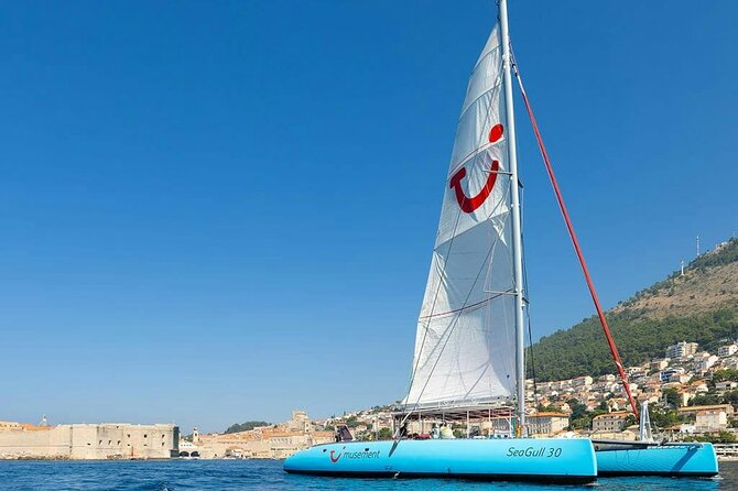 Dubrovnik Sunset Catamaran Cruise with drinks - Old Town from the water: walls, harbor views, and Lokrum Island