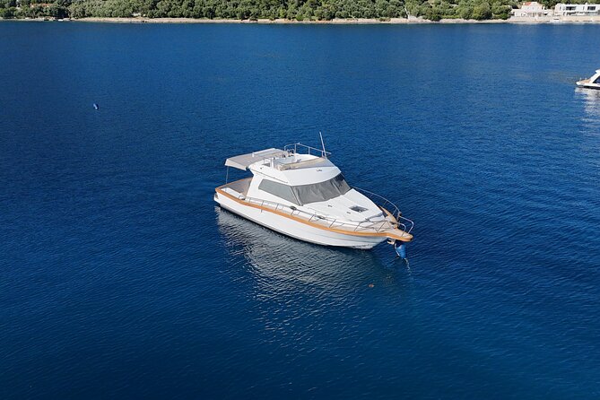 Explore Elaphiti islands by Private trip with Ferretti mini yacht - Stop 1: Sjekirica Beach for turquoise water, caves, and snorkel time