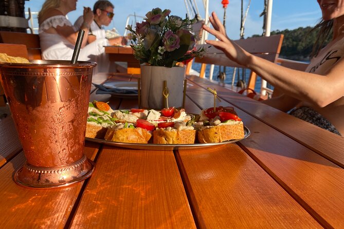 Gastro Cruise | Cruise around Dubrovnik Old Town with Lunch - Stop 1: Seeing the City Walls from the water, with local snacks and a fish lunch