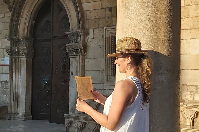 Mysterious Game of Dubrovnik - Private Mystery walking tour - Sponza Palace and Orlando Column: looking up for clues