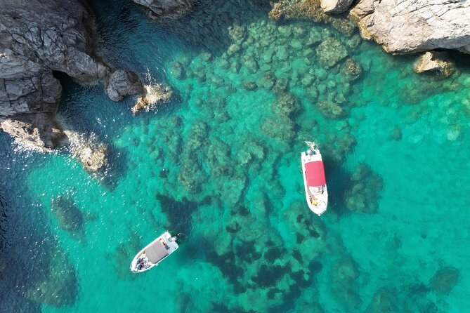 Private Panorama Dubrovnik Boat Tour - St. Jakov Beach: Cliffs, Sand Time, and Old Town Photos in the Distance