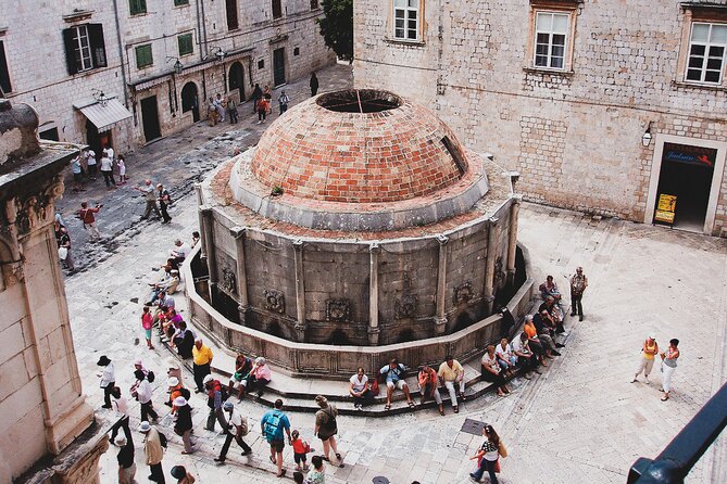 Private Walking Tour in Dubrovnik: Must See and Hidden Gems with Local Expert - City Harbor finish: rocky beach views and siege memory